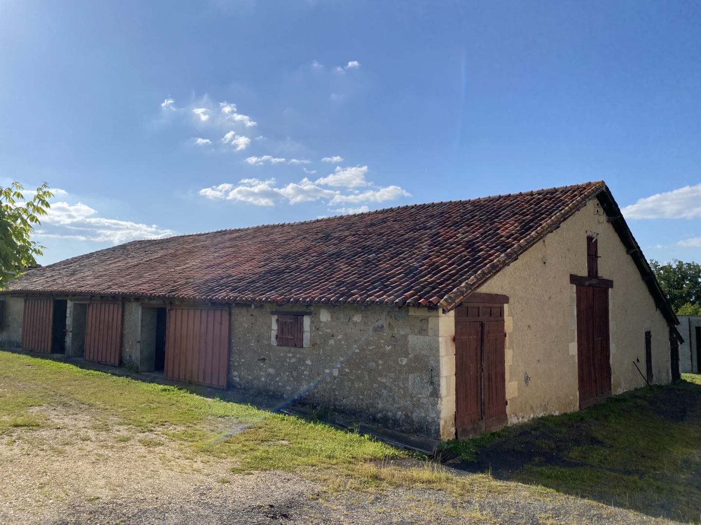 Spacious house with huge outbuildings and enclosed grounds. Bedroom on the ground floor. Shops on foot.