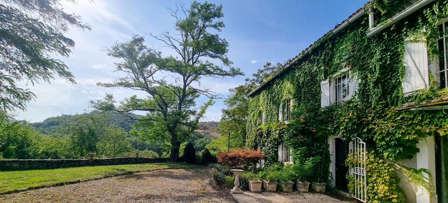 Charming 7-Bedroom Stone Country Estate with Income Potential