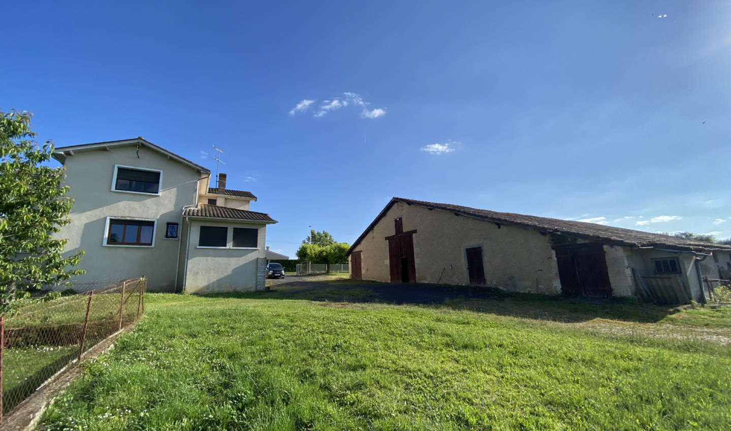 Spacious house with huge outbuildings and enclosed grounds. Bedroom on the ground floor. Shops on foot.